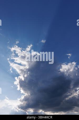 Sun glowing behind a dark cloud, Finland Stock Photo