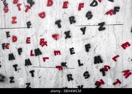 Letters of the alphabet painted on a wall. Ideal for creative concepts and backgrounds Stock Photo