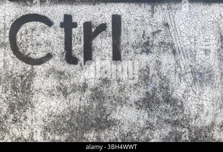 Grunge graffiti depicting the Ctrl key. Ideal for creative backgrounds computer-based concepts. IT piracy. Deep web. Hackers Stock Photo