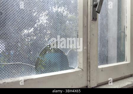 Old abandoned building. Glass of old windows broken. Abandoned house Stock Photo