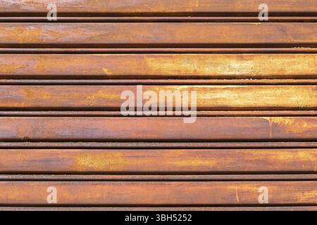 Rusty metal shutter gate. Grungy background texture Stock Photo