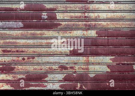 Roller shutter door, rusty metal background Stock Photo