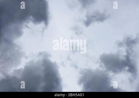 Grey and bluish tragic cloudscape with various density chaotic clouds Stock Photo