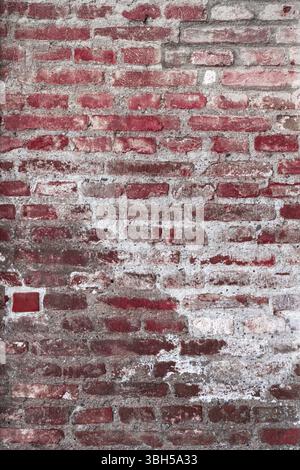 Details of the surface of an old wall in stones red and gray Stock Photo