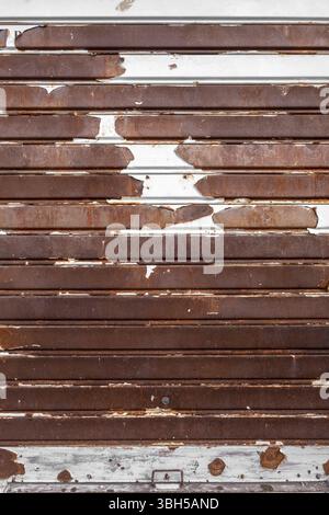 Old rusty garage shutter. Ideal for concepts and backgrounds Stock Photo