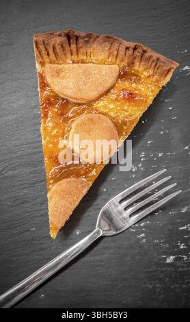 Piece of cake with fig jam, served on a slate plate. Healthy eating Stock Photo