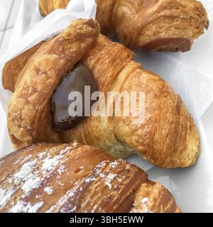 Chocolate croissants close-up. Delicious fresh croissants with chocolate Stock Photo