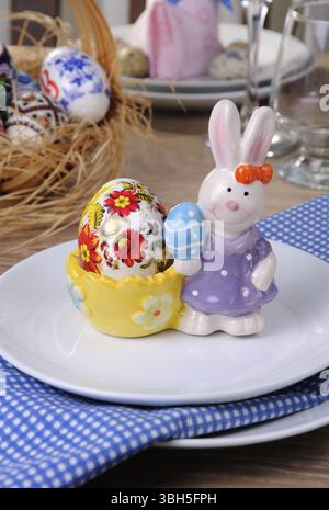 Easter Bunny stand with my drawing egg on a festive table Stock Photo