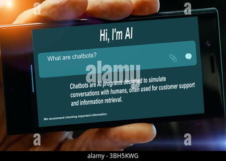 Question for AI on tablet screen. What are chatbots? Stock Photo