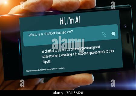 Question for AI on tablet screen. What is a chatbot trained on? Stock Photo