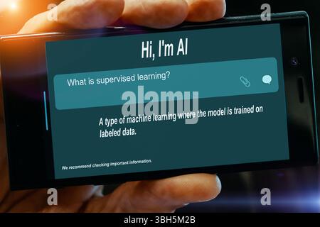 Question for AI on tablet screen. What is supervised learning? Stock Photo