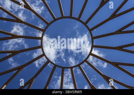 Bottom view of an iron structure, with blue sky in the background Stock Photo
