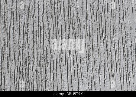 Detail of a bumpy plaster walls grey color close-up as a texture, horizontal Stock Photo