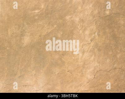 Texture of old rustic wall covered with brown stucco Stock Photo
