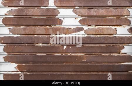 Old rusty garage shutter. Ideal for concepts and backgrounds Stock Photo