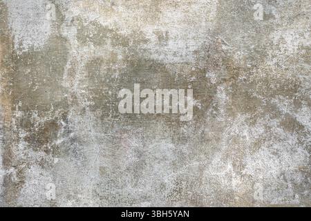 White green red old wall with damaged plaster. Old shabby wall with peeling plaster Stock Photo