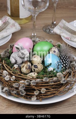 Easter colored eggs scattered on a green moss as an element of a holiday decoration ideas Stock Photo
