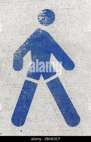 Pedestrian street sign on a rough light floor Stock Photo