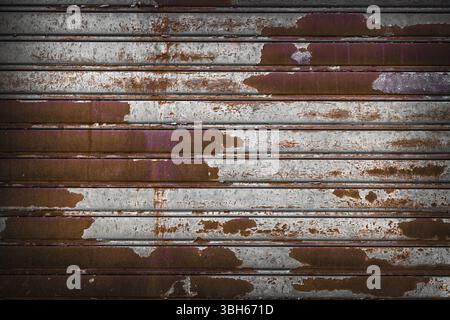 Roller shutter door, rusty metal background Stock Photo