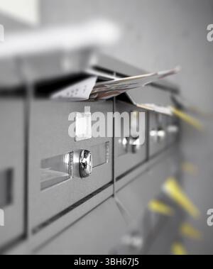 Mail boxes filled of leaflets and letters. Junk mail. Ideal for concepts Stock Photo