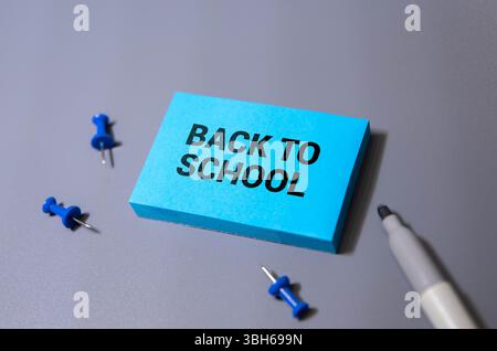 Different stationery and text BACK TO SCHOOL on green background Stock Photo