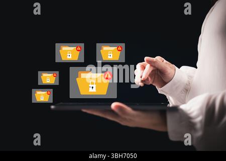 Cybersecurity warning on data folders with lock icons and red warning alerts signs. Represents encryption error, ransomware attack, system breach, dig Stock Photo