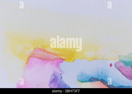 Macro close-up of an abstract colorful watercolor gradient fill background with watercolour stains. Textured paper background with copy space. Stock Photo