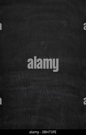 Front view of dirty, stained and dark, almost black, wall. Abstract full frame textured grunge background in black and white, copy space. Stock Photo