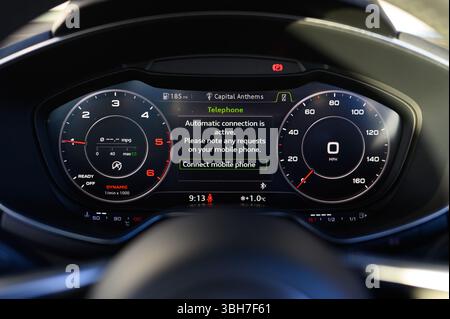 Virtual Cockpit, Digital Dashboard Displaying Map and Information About a Vehicle in Front of the Steering Wheel Including a Speedometer, Dials, Navig Stock Photo
