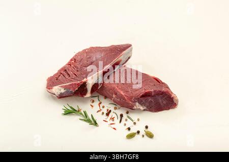 Raw veal pieces isolated on white background. Stock Photo