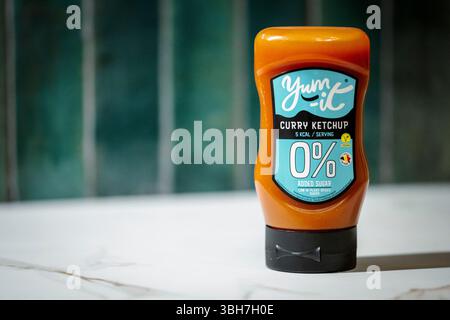 Antwerp, Belgium, June 7th 2025: Bottle of Yum-It plant-based vegan curry ketchup Stock Photo