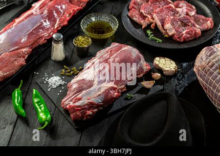 Large fresh raw veal chunk, black background. Stock Photo