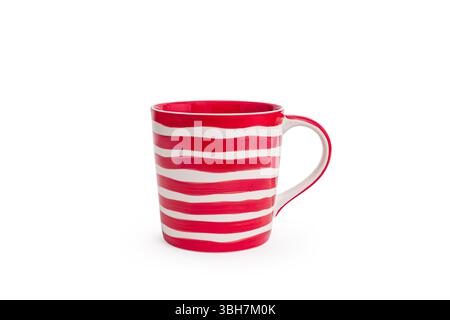 A red and white striped mug with a handle, featuring  bold stripes for a vibrant design isolated on white background. Ideal for advertising kitchenwar Stock Photo