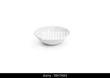 A simple white small bowl centered on a plain white background, emphasizing its minimalist design. ideal for serving sauce, spices, or dips Stock Photo