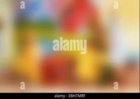 An eye-catching abstract artwork showcasing dynamic swirls of bright red, yellow, and green paint creating a vivid textured background, ideal for crea Stock Photo