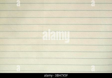 A lined vintage paper background. A blank old paper sheet. A yellow note page for a copy. Stock Photo