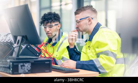 Mechanical engineering team working in robotic technology lap for research and develop for manufacturing automation and robotics. Stock Photo