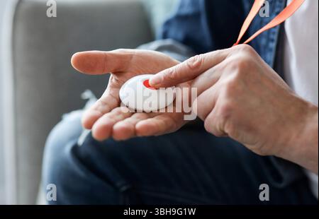Closeup Of Man's Hand Pressing Alarm Button For Emergency Stock Photo