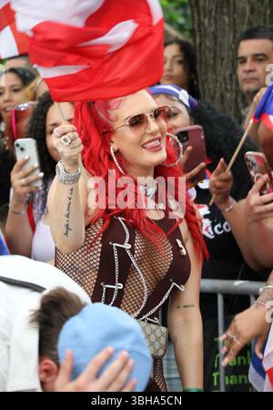 New York, USA. June 8, 2025, New York City, New York: (new) famous people at 2025 puerto rican day parade in new york. June 8, 2025, new york, usa: lil twist (with dreadlock), original name christopher lynn moore, a dallas-based rapper, justina valentine (red hair), american television host and rapper and conceited (with puerto rican jersey #13), participated in the national puerto rican day parade in new york city Credit: ZUMA Press, Inc./Alamy Live News Stock Photo