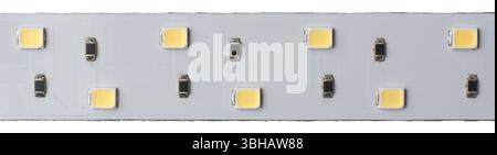close-up macro view of white LED strip light isolated white background, flexible electronic components designed for illumination Stock Photo