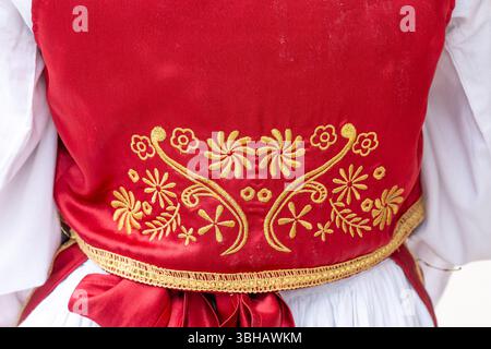 Folklore Elegance – Red Silk Dress from the Back Stock Photo