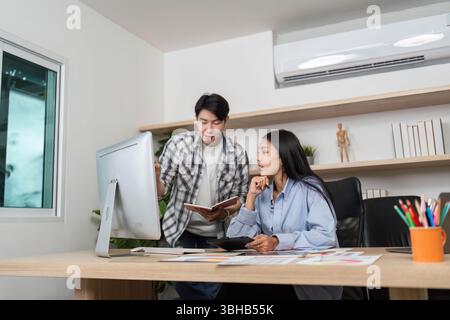 UX and UI Design Discussion. Designers collaborating on a project in a bright office. Stock Photo