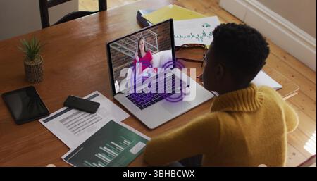 Image of 6g text banner over african american woman having a image call on laptop at home. Global networking and business technology concept Stock Photo
