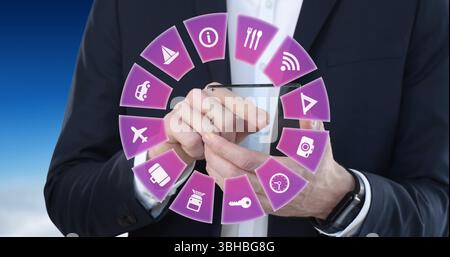 Holding businessman in suit interacting with smartphone at studio, with floating purple app icons. Technology, innovation, connectivity, digital, prof Stock Photo