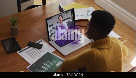 Image of 6g text banner over african american woman having a image call on laptop at home. Global networking and business technology concept Stock Photo