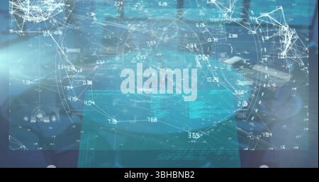 Displaying holographic data overlay over laptop keyboard on desk with connecting nodes and readouts. Technology, data visualization, futuristic, innov Stock Photo