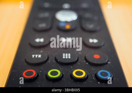 Universal remote control for TVs, macro composition of programming buttons. Stock Photo