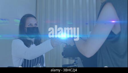 Composition of smiling businesswoman using smartphone in office with motion blur. Global business connections data processing and technology concept d Stock Photo