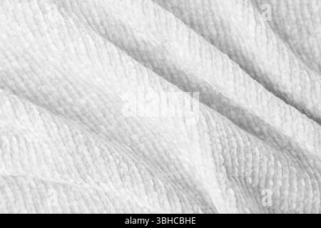 Texture of white knitted fabric as background, top view Stock Photo