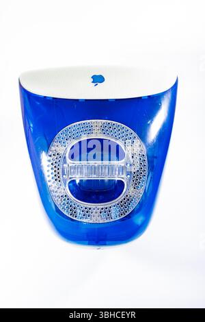 Vintage Apple iMac G3 computer in blue and white with logo visible, rear view isolated  against a plain white studio background Stock Photo
